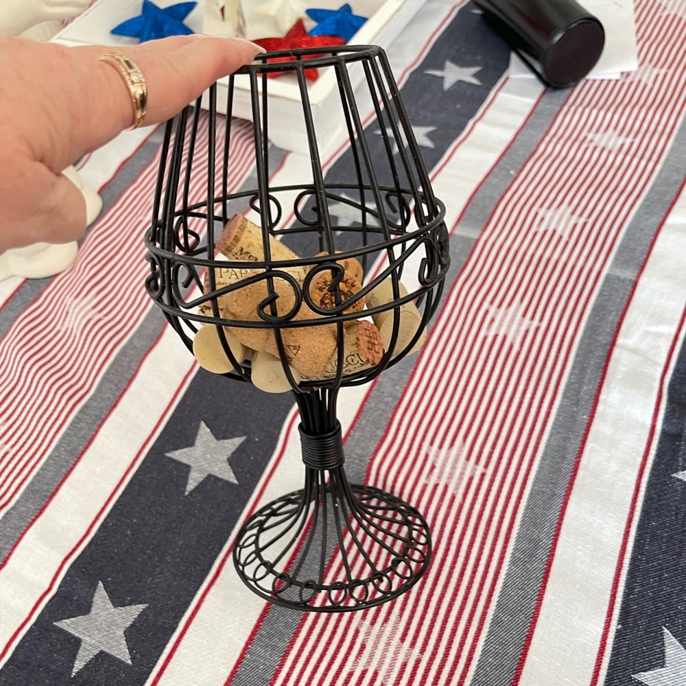 Black wire wine glass to hold corks. Great kitchen decoration